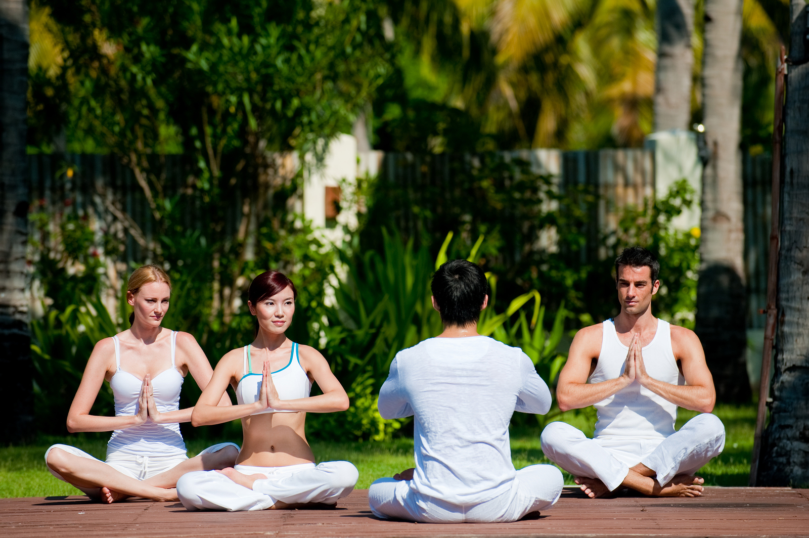 A group of friends practicing yoga